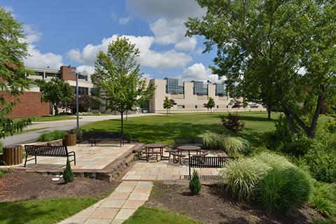 View of patio near pond at the back of the Brighton campus